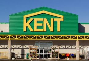 Kent store exterior with yellow signage on a green facade.