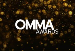 OMMA Awards text with golden bokeh background.