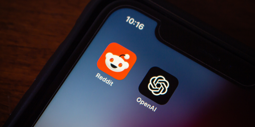 Close-up of a smartphone screen displaying Reddit and OpenAI app icons.