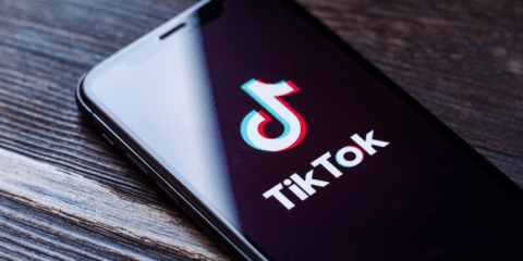 Smartphone displaying the TikTok logo on screen.