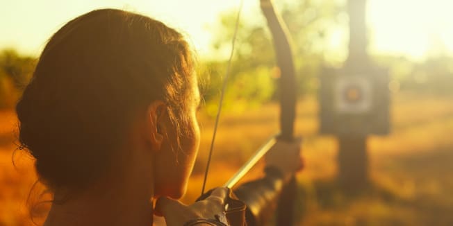 Archer shooting her bow.