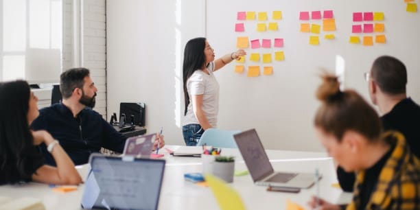 A team of marketers planning content strategy in a meeting.