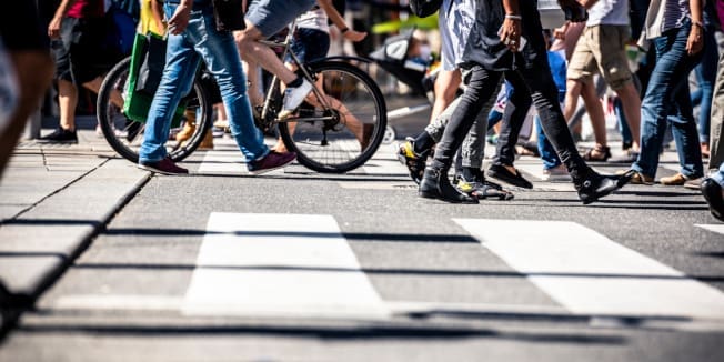 People on pedestrian crossings, on foot and by bicycle