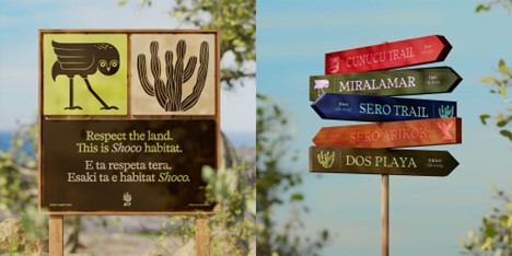 "Respect the land. This is Shoco habitat." sign and colorful directional trail signs with natural background.