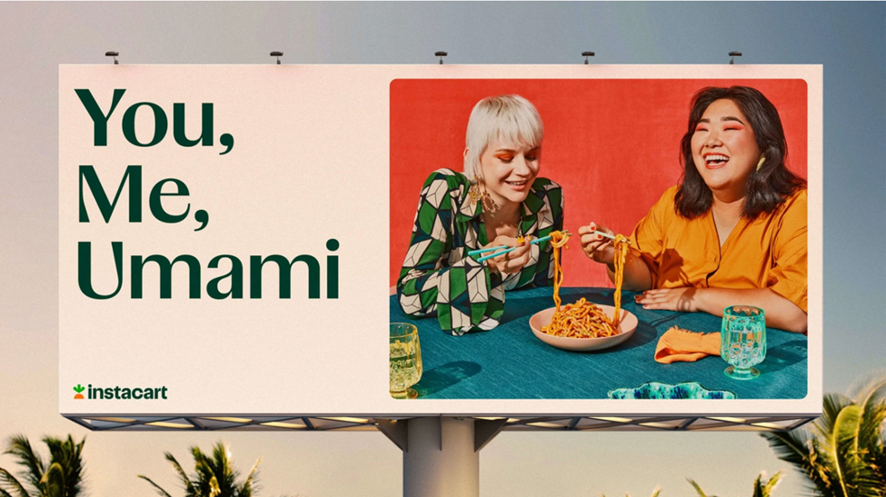 Billboard with text "You, Me, Umami" showing two people enjoying noodles with chopsticks, and the Instacart logo.