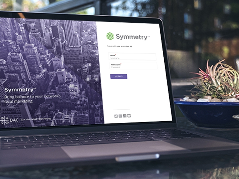 Laptop displaying Symmetry login page