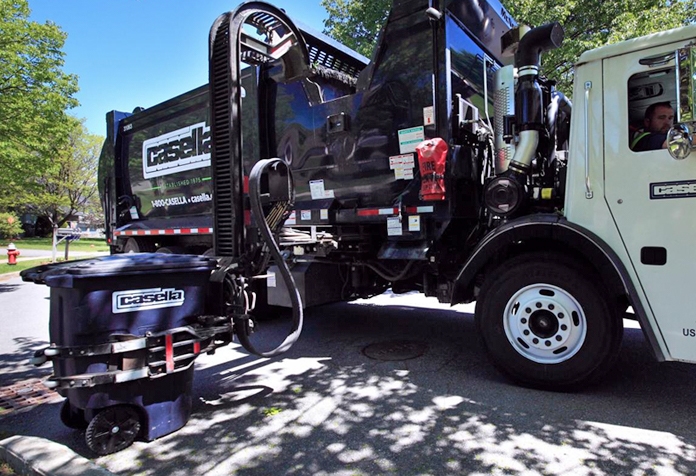 Casella recycling truck collecting a Casella-branded recycling bin