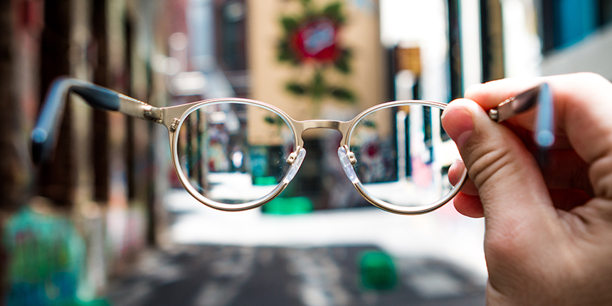 Glasses putting a blurry street scene into focus